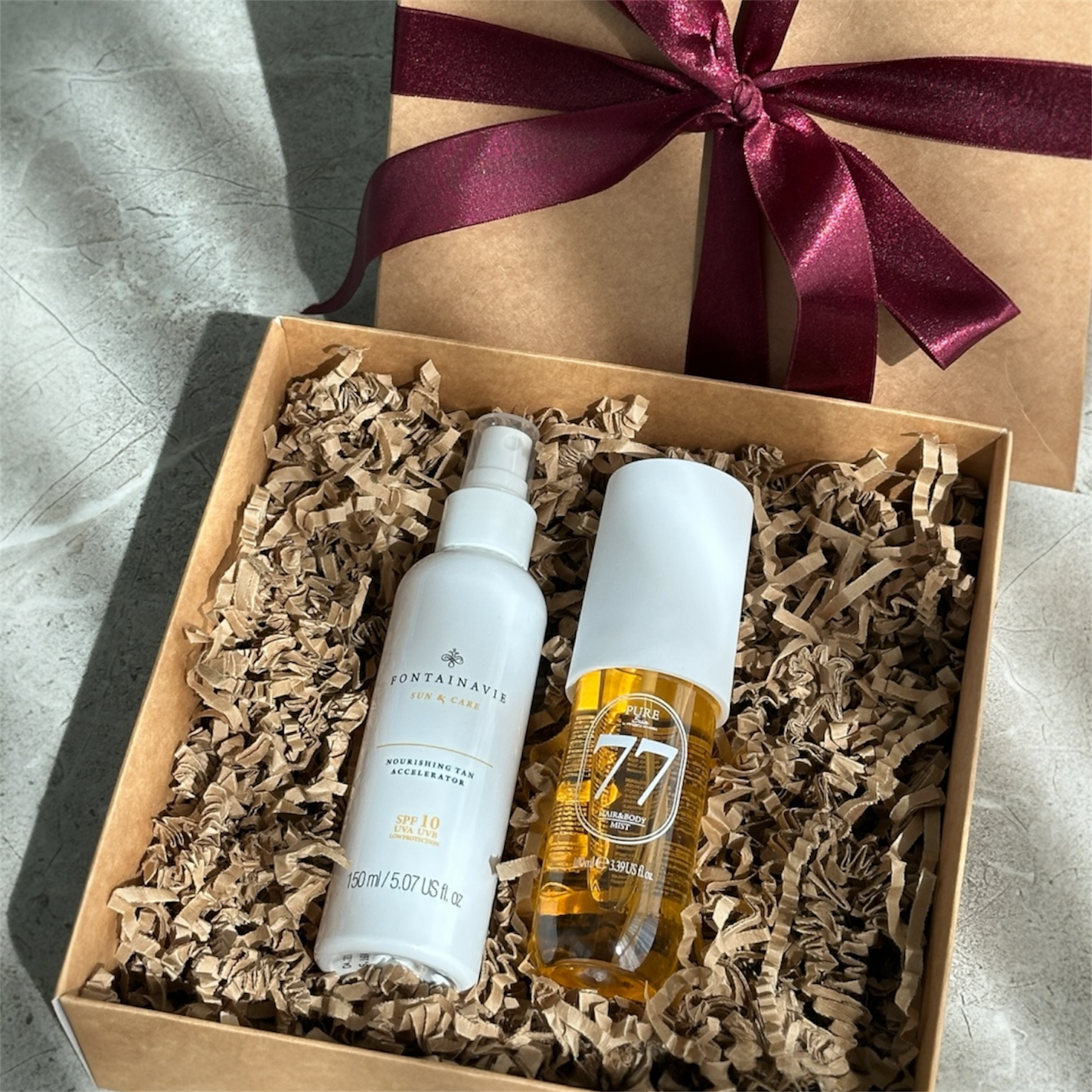 Dovanų rinkinys: Kūno ir plaukų dulksna PURE SUN + įdegį skatinanti priemonė su SPF10